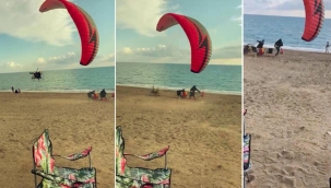 Paramotor yere çakıldı, sahilde oturan aile son anda kurtuldu